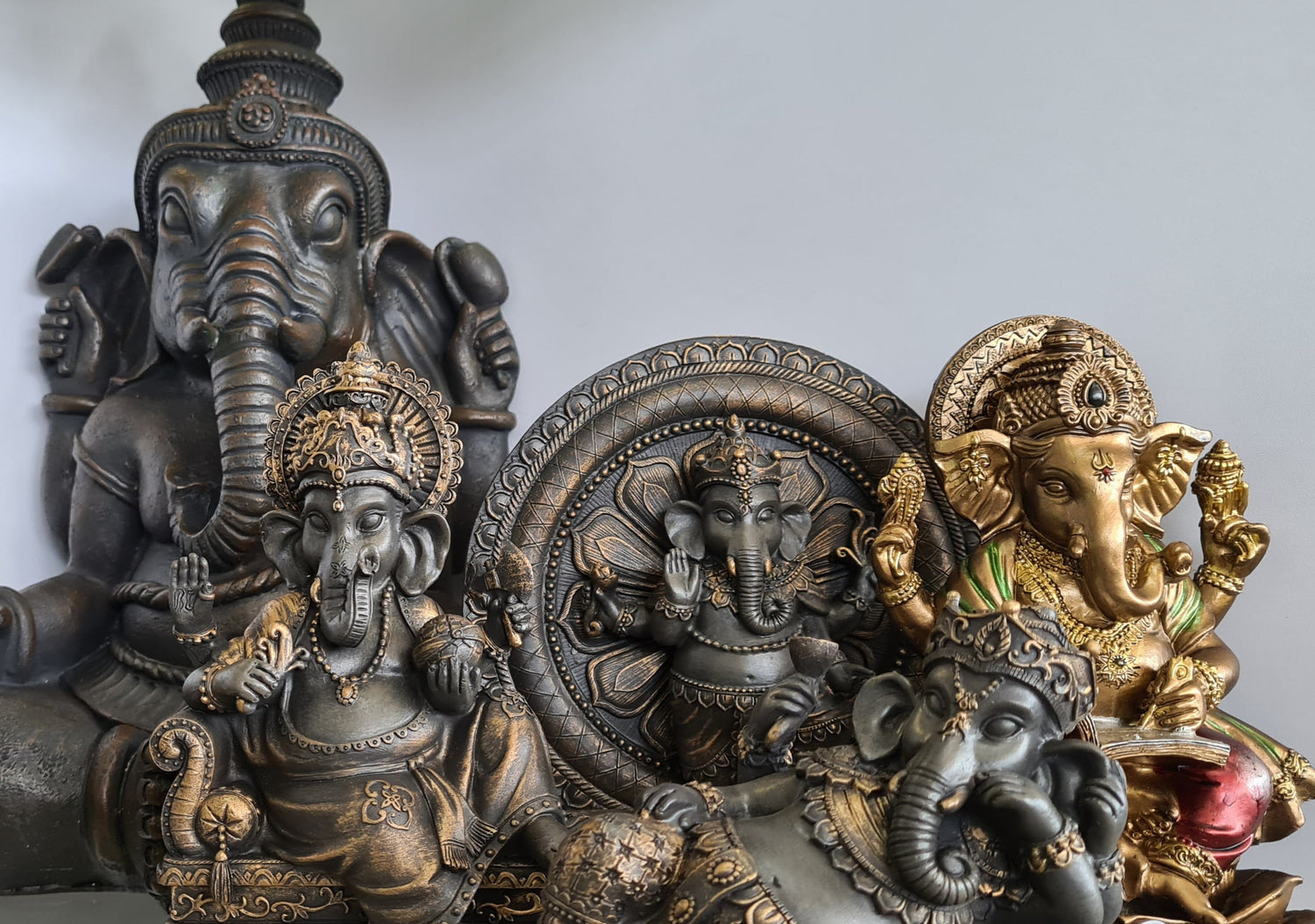 Shelf displaying Ganesha statues - remover of obstacles