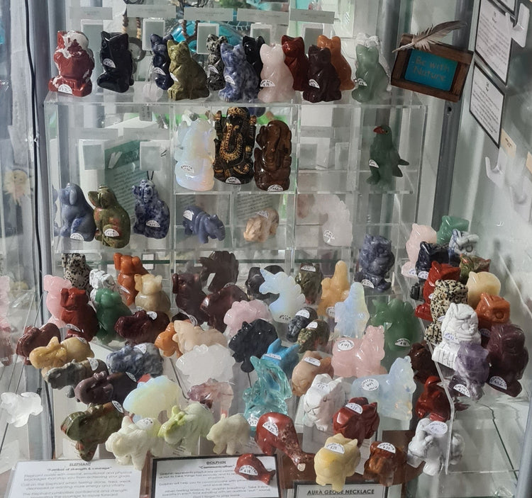 Display of crystal carvings - Elephants, Turtles, Owls, Frogs etc in a variety of crystals 