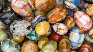 A stack of crystal eggs in a variety of crystal types